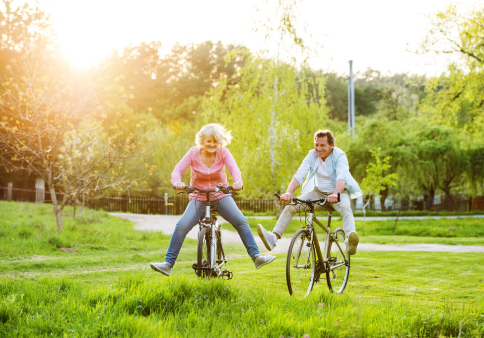 Beautiful,Senior,Couple,With,Bicycles,Outside,In,Spring,Nature.