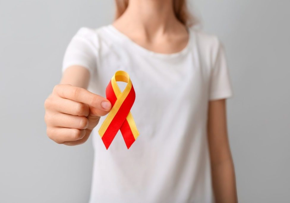 Woman,In,White,T-shirt,With,Awareness,Ribbon,On,Grey,Background,