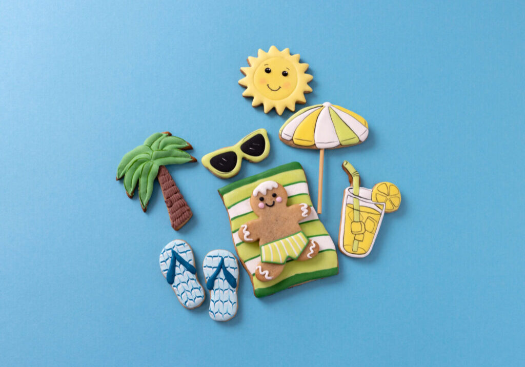 Gingerbread,Man,Lying,On,Blue,Background,Along,With,Other,Summer